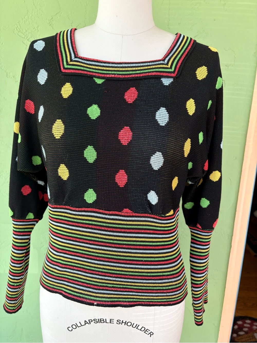 Vintage 1970s black sweater with multicolored polka dots and stripes